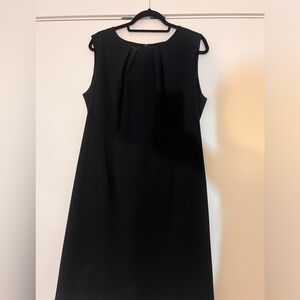 Black size 18 business casual dress. Mid length. Fit is more like 16.
